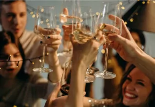 people toasting with wine glasses at fun coast tours